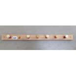 Coat rack with shotgun shell hocks