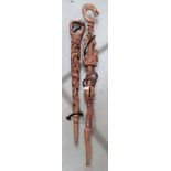 2 carved Zimbabwean walking sticks