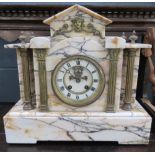 Marble mantle clock with brass columns to the side