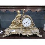 French mantle clock with ornate brass case