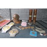 Cage with AA badges and diving helmet, letter opener, various insignia, medallions and hip flask