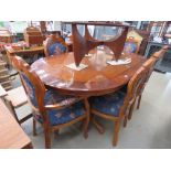 Oval walnut finished dining table with 6 chairs to include 2 carvers