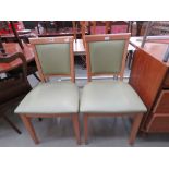 Pair of beech and green leather effect dining chairs