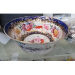 (rr may 410) An early 19th century Coalport bowl gilt decorated with flowerheads within a blue