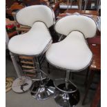 Pair of cream leather effect and chrome swivel bar stools