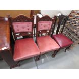 Pair of pink upholstered carved dining chairs plus a dining chair with red leatherette seat