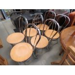 Six chrome dining chairs with beech seats