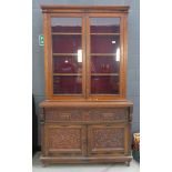 Oak secretaire with carved panels