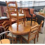 Oval pine dining table and 6 chairs to include 2 carvers
