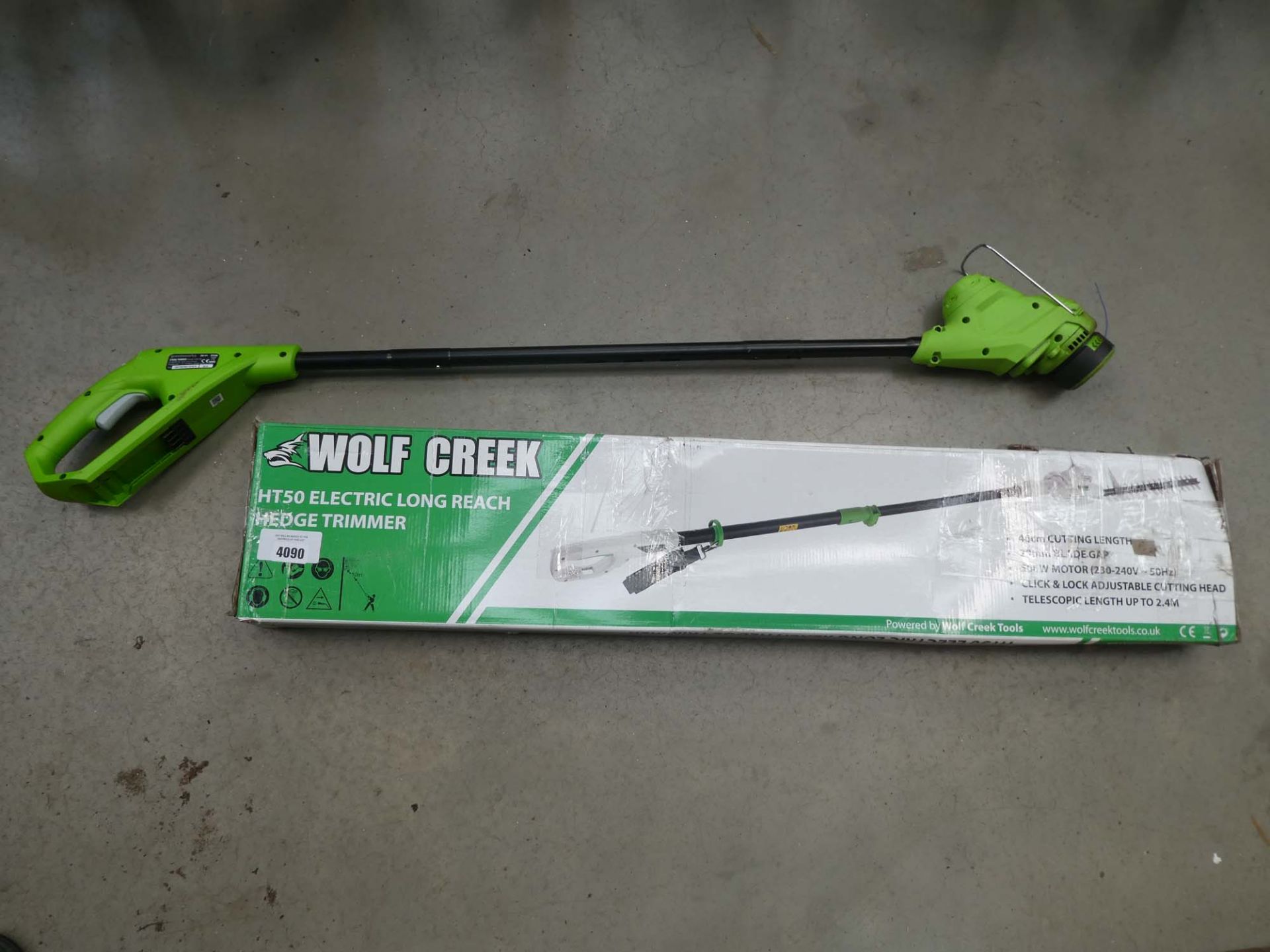 Boxed Wolf Freak electric long reach hedgecutter and one other