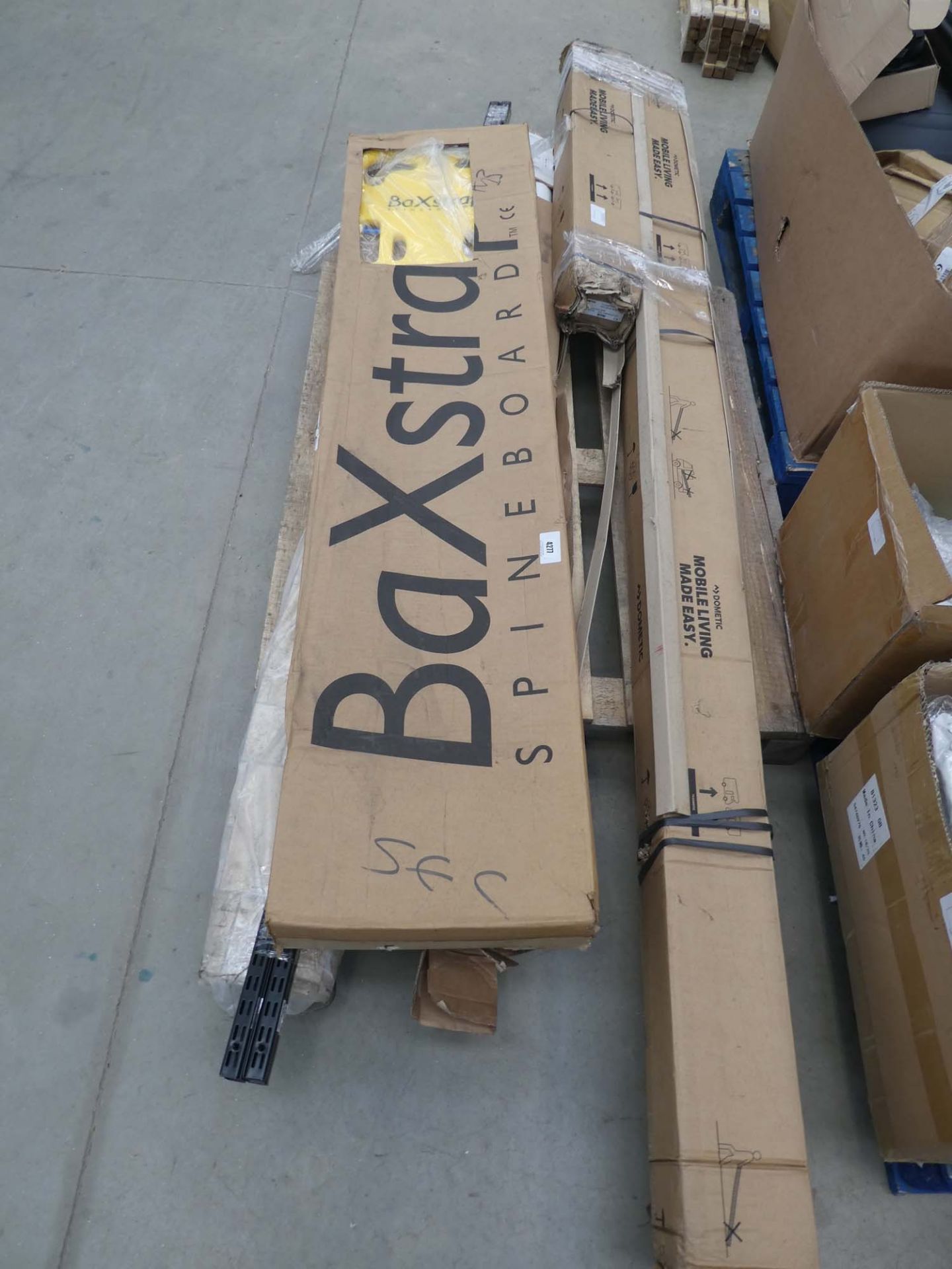 Pallet of various items inc. spinal board, vinyl, shelf uprights, flue pipe and other items