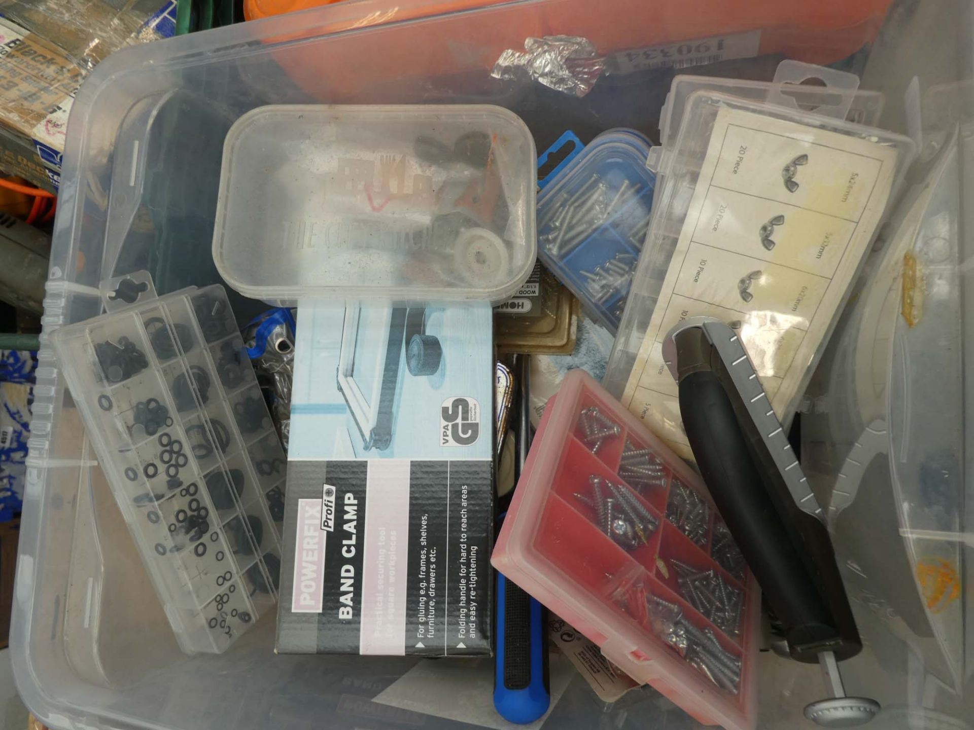 Plastic box containing fittings inc. wing nuts, band clamp, screws, bolts etc