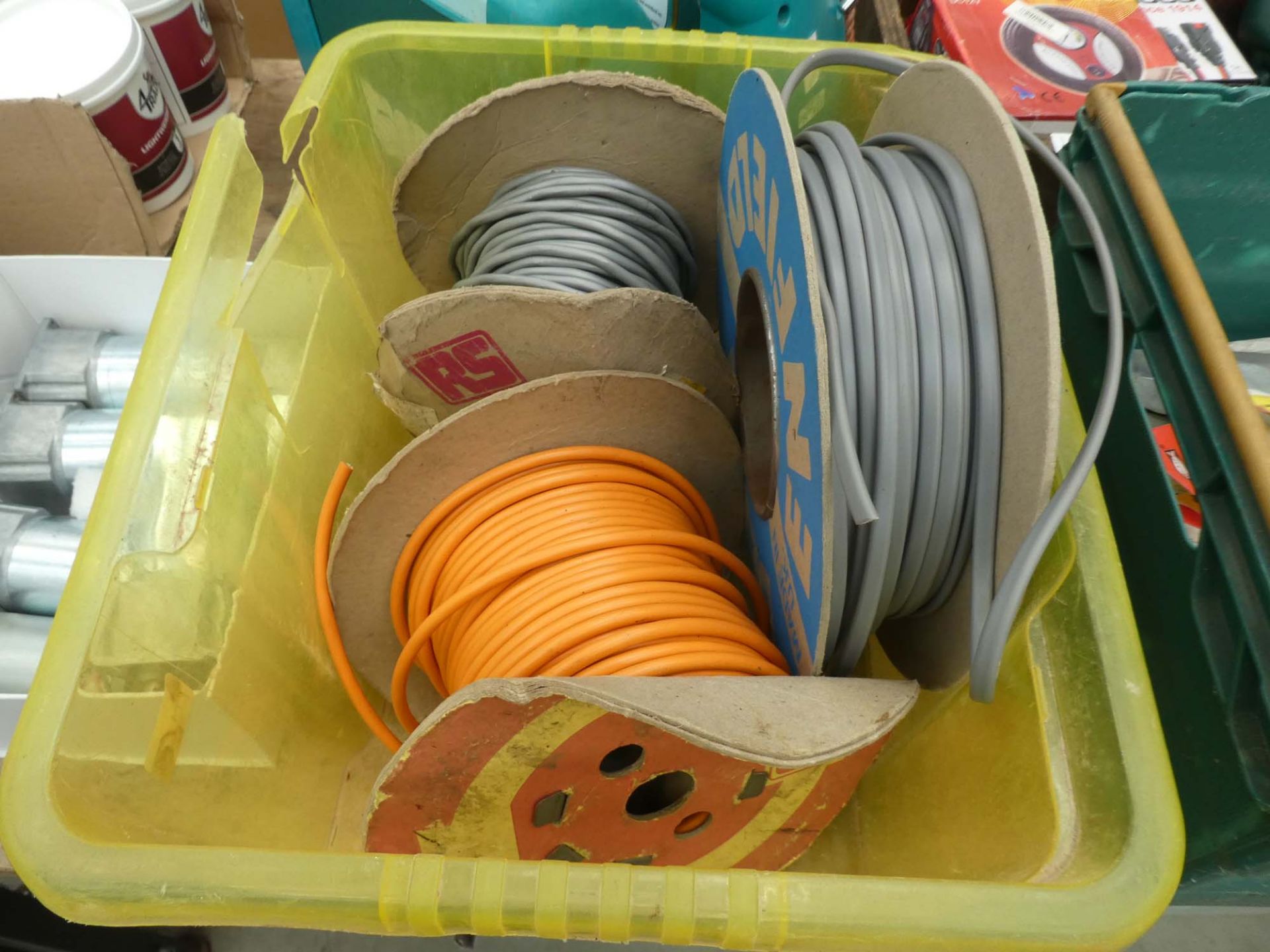 Plastic box containing 3 rolls of cable