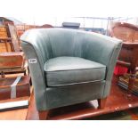 Leather covered tub chair in sea green