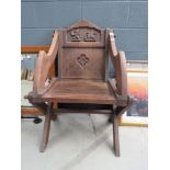 Oak ceremonial chair with lion and griffin decoration to back