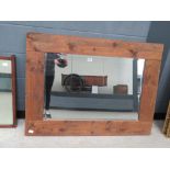 Rectangular mirror with a sawn wooden frame