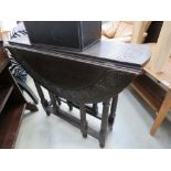 Carved drop leaf/gate legged table with carving on turn support