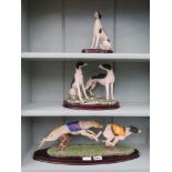 3 figurines of racing greyhounds