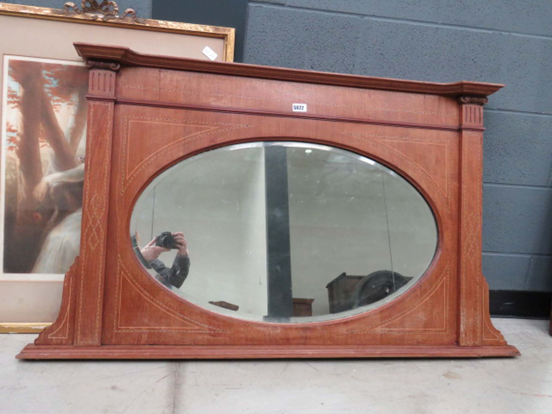 Inlaid oval over mantle mirror