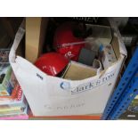 Box containing children's toys, books, and household goods