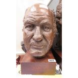 Metal casting of man's head