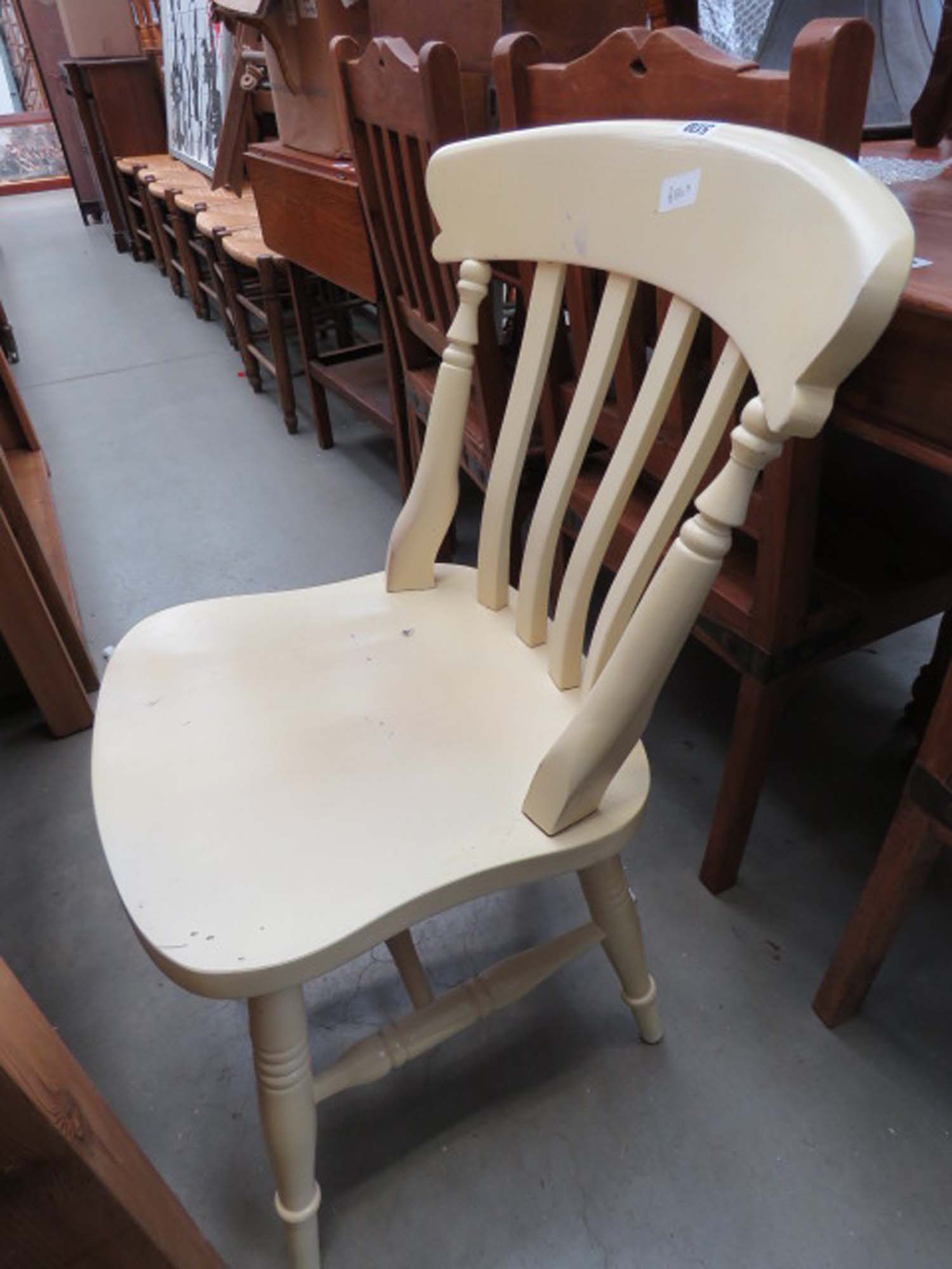 Yellow painted slat back kitchen chair