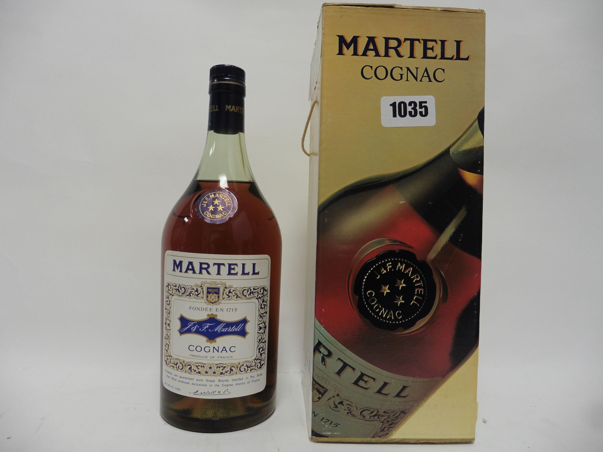 An old bottle of J&F Martell 3 star Cognac with box,