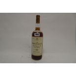 A bottle of The MACALLAN 12 year old Single Highland Malt Scotch Whisky matured in Sherry wood,