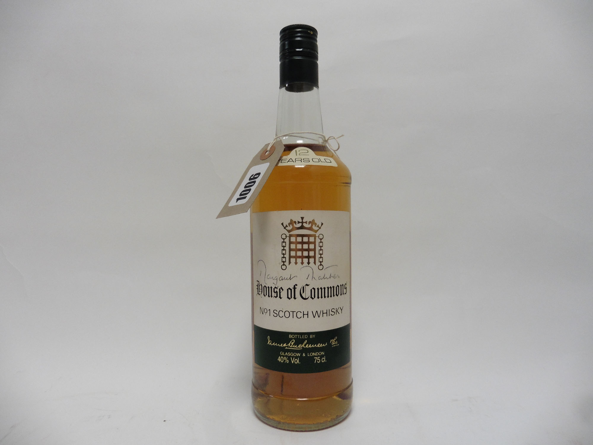 A bottle of House of Commons No1 Scotch Whisky by James Buchanan circa 1980's bearing signature