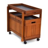 A 1970/80's teak bar cart with a detachable tray, two sliding trays and a fitted interior, l.