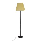Carl J Christensen: a black standard lamp on a cast metal base with a pale yellow shade