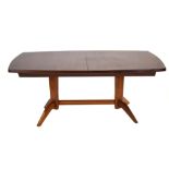 A 1950/60's Gordon Russell Burford Range dining table in Bombay rosewood and mahogany,