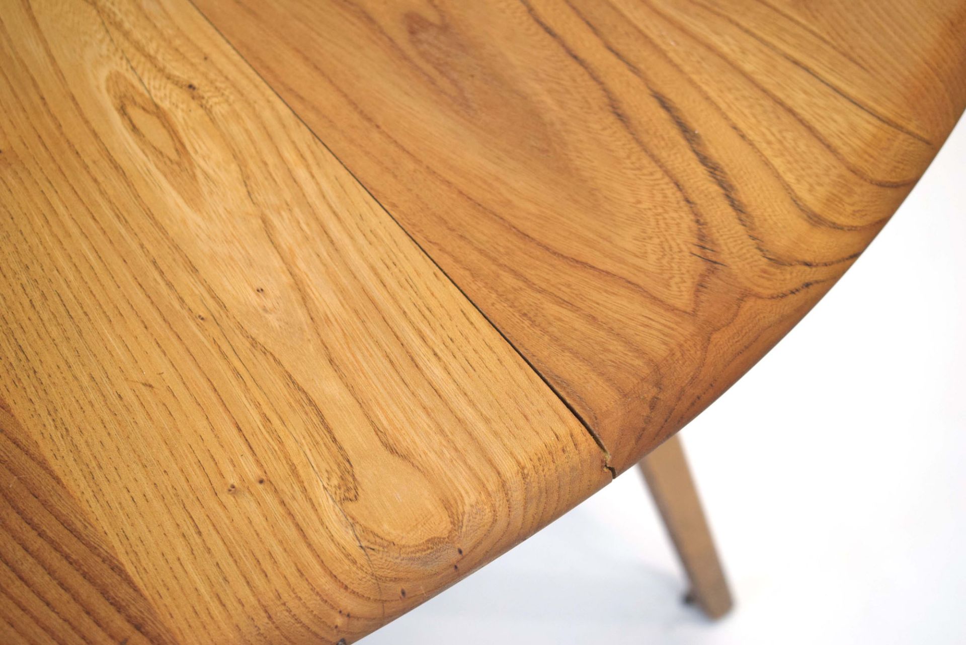 An Ercol elm drop-leaf dining table on beech tapering legs, d. - Image 2 of 3