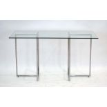 *WITHDRAWN* A dining/side table, the rectangular glass surface resting on two tubular bases,
