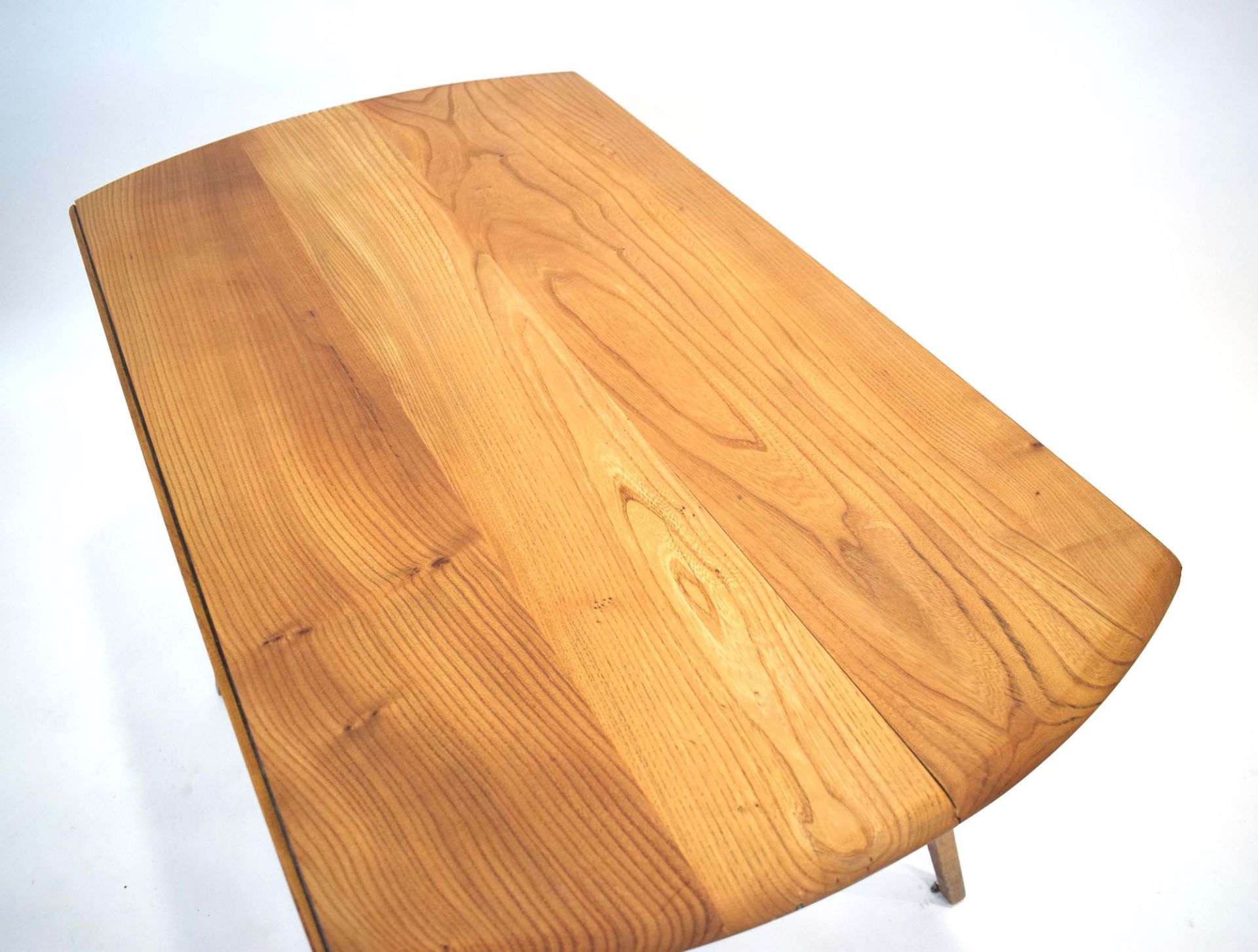 An Ercol elm drop-leaf dining table on beech tapering legs, d. - Image 3 of 3