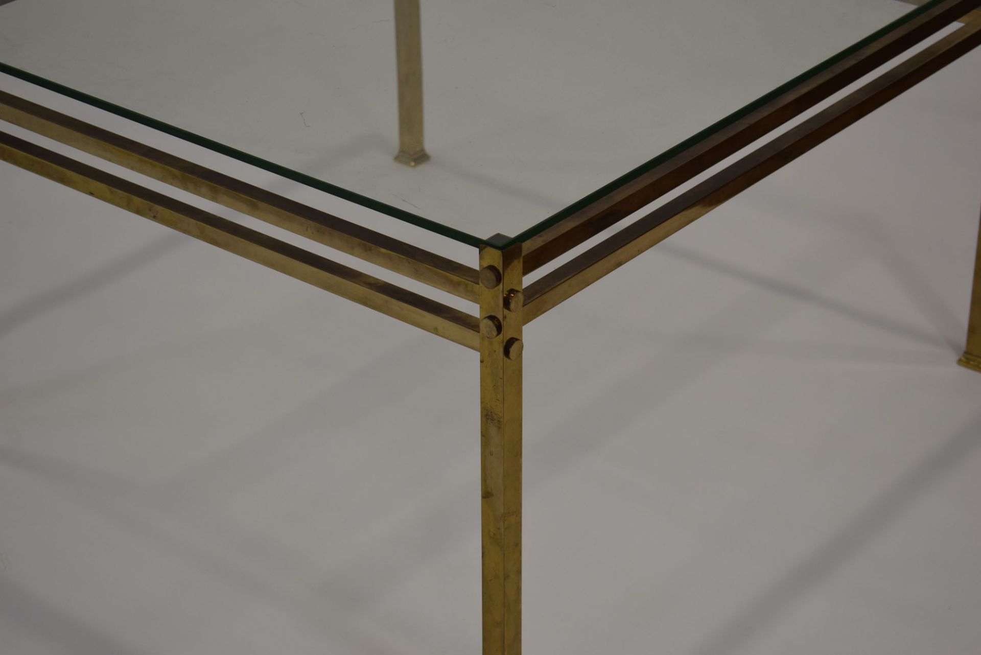 A 1970's brass finished occasional table with a square glass surface, w. - Image 2 of 2