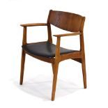 A 1960's Danish designed elbow chair with an oak frame and black vinyl upholstery *Sold subject to