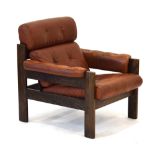 A 1960's brown leather and button upholstered armchair with an oak finished frame *Sold subject to