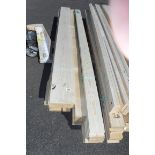 2 bundles of timber planks and 2 fence posts