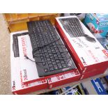 4 boxed and 1 unboxed keyboard and mouse with laptop stand