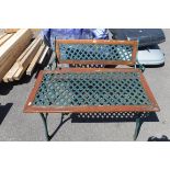 Wrought iron and wooden garden bench together with matching table