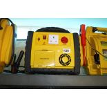 Yellow and black car jump starter with air compressor