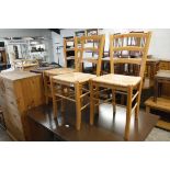 Three wooden chairs with rush seats