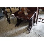 Nest of three mahogany effect occasional tables