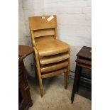 Stack of four child's chairs with bent ply seats and backs