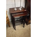 Nest of three slender mahogany occasional tables