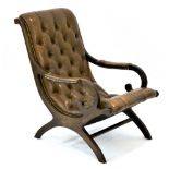 A mahogany and tan leather button upholstered 'Paris' armchair with scrolled arms