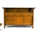 A Commercial Arts & Crafts oak sideboard, the superstructure over two drawers and three drawers,