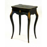 A 19th century ebonised and gilt metal mounted sewing cabinet on cabriole legs, w.