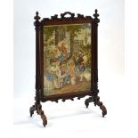 A 19th century rosewood tapestry fire screen with two turned columns and splayed feet, h.